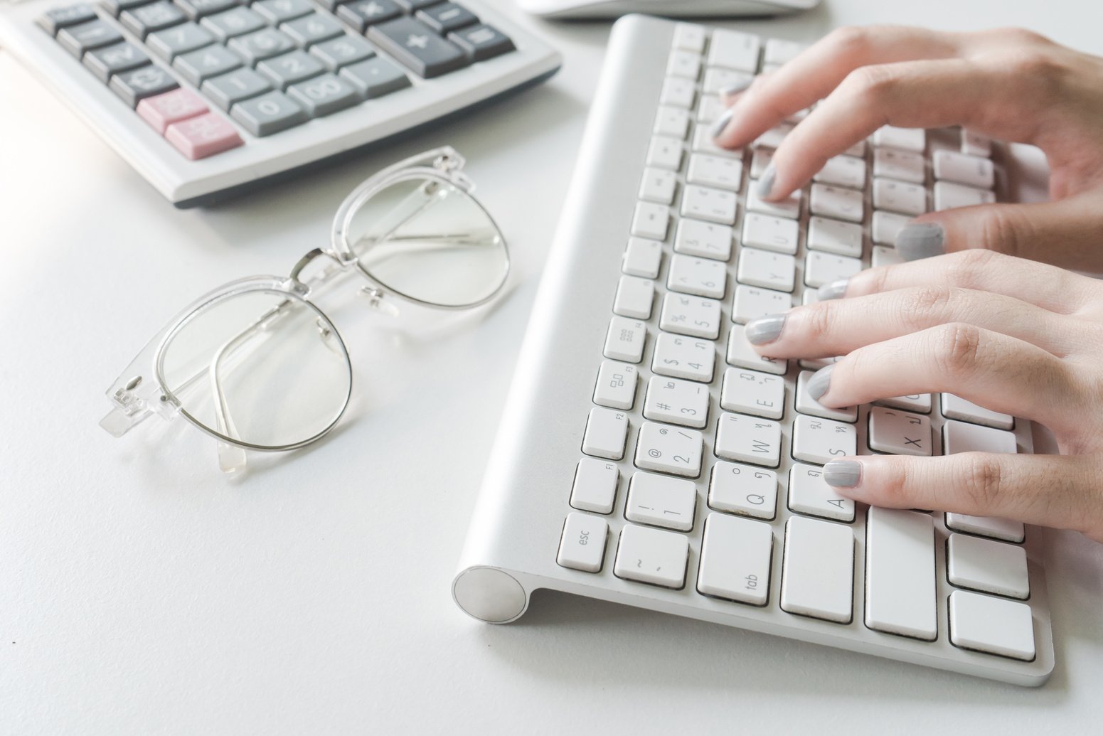 Woman Typing on Keyboard